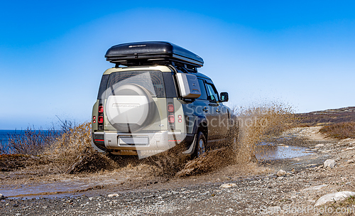 Image of Rybachy, RUSSIA - May 30 2022: Off-roading New Land Rover Defend