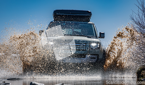 Image of Rybachy, RUSSIA - May 30 2022: Off-roading New Land Rover Defend