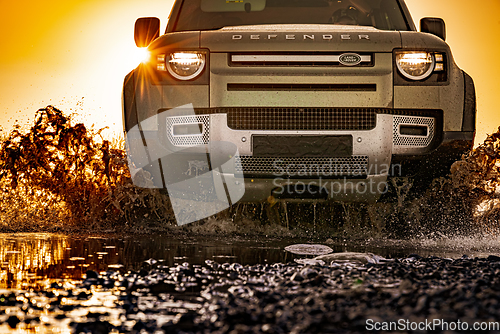 Image of Rybachy, RUSSIA - May 30 2022: Off-roading New Land Rover Defend