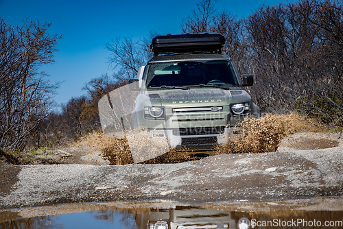 Image of Rybachy, RUSSIA - May 30 2022: Off-roading New Land Rover Defend