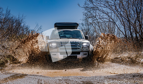 Image of Rybachy, RUSSIA - May 30 2022: Off-roading New Land Rover Defend