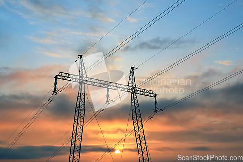 Image of Electricity Pylon Against Sunrise Sky