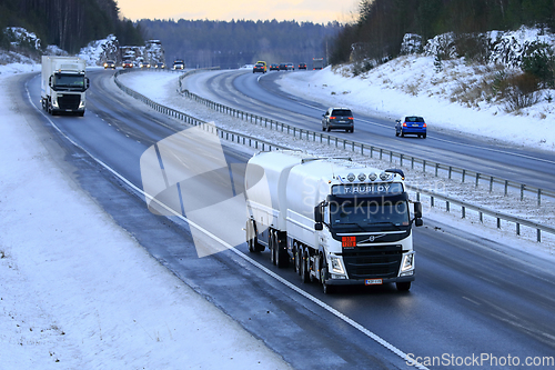 Image of White Volvo FM Fuel Tanker in Motorway Traffic