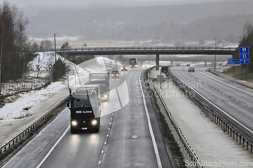 Image of Motorway Truck Traffic on a Foggy Day of Winter