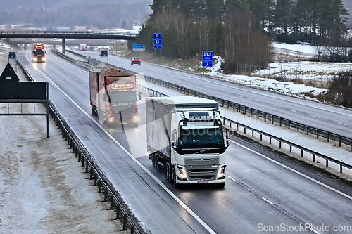 Image of Freight Trucks on Motorway on a Foggy Day of Winter