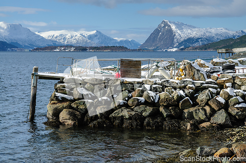 Image of harbor with snow and mountains