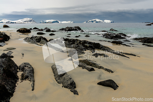 Image of rocks in the sand on the beach