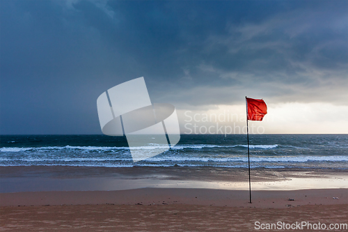 Image of Storm warning flags on beach. Baga, Goa, India