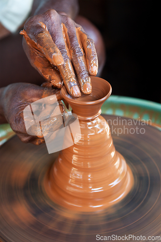 Image of Potter throwing