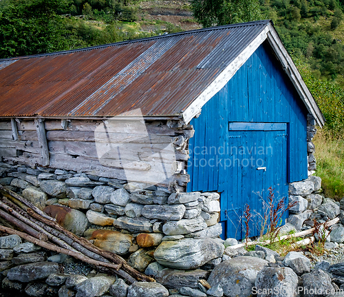 Image of old boathouse on the shore