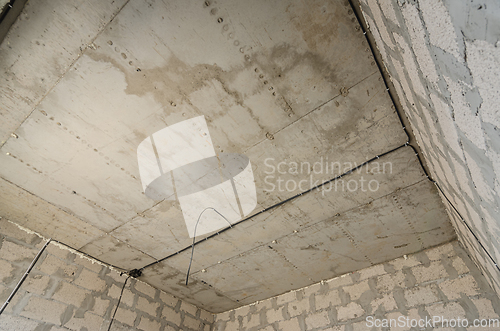 Image of Construction of an individual residential building, view of the monolithic reinforced concrete ceiling in the room