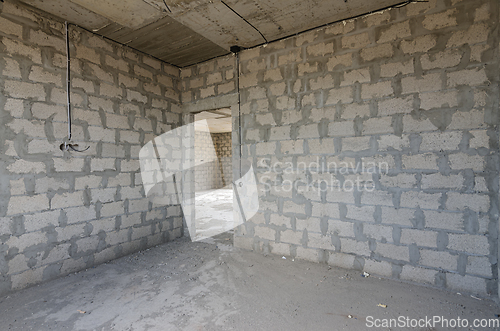 Image of Construction of an individual residential building, view of the corner of a room with a doorway