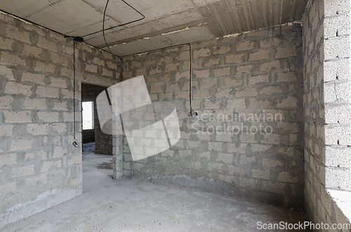Image of Construction of an individual residential building, view of the walls of the room between the doorway and the window