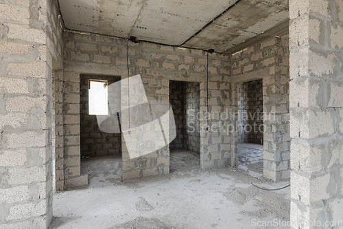 Image of Construction of an individual residential building, view of the doorways to the bathrooms and rooms