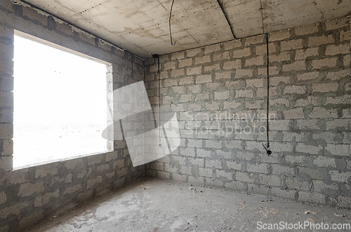 Image of The construction of an individual residential building, a view of the expanded clay concrete wall without finishing and a large spacious window