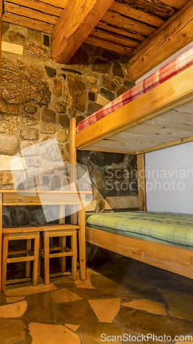 Image of Bedroom in a Wooden Chalet