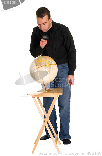 Image of Man Examining The Globe