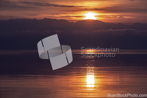 Image of Sunrise with sea and mountains, landscape 