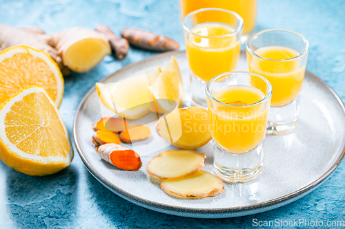 Image of Boosting immune system - homemade healthy Ginger Lemon Turmeric Shot 