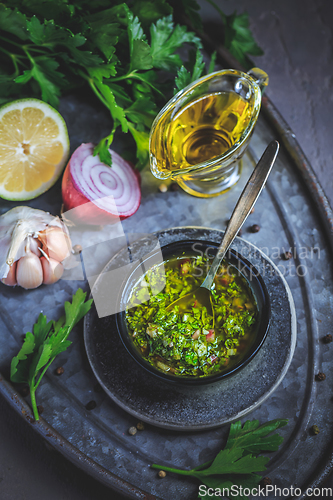 Image of Chimichurri verde - Fresh traditional chimichurri sauce for barbecue meat