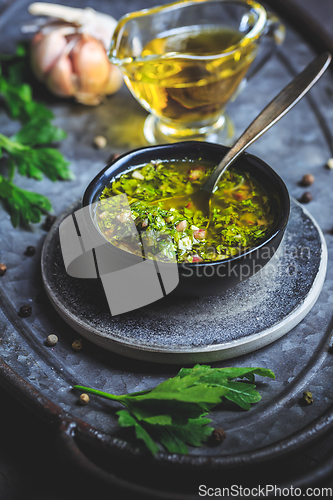 Image of Chimichurri verde - Fresh traditional chimichurri sauce for barbecue meat