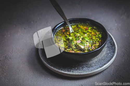 Image of Chimichurri verde - Fresh traditional chimichurri sauce for barbecue meat