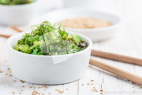 Image of Wakame seaweed salad with sesame seeds. Traditional Japanese food.