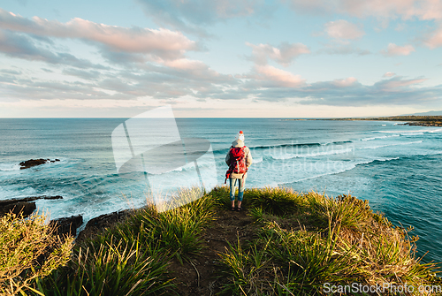 Image of Watching the ocean as the sun begins to set