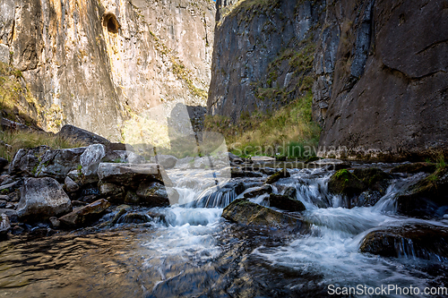 Image of Icy cold cvreek flowing through Snowy Mountains