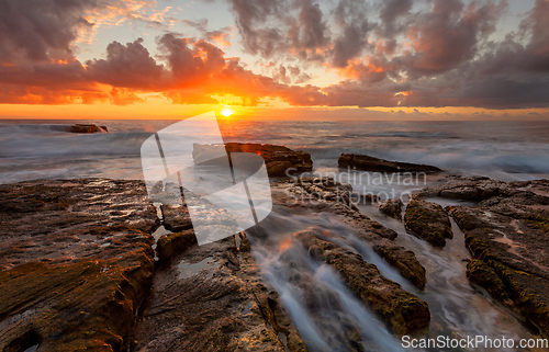 Image of Tangerine sunrise over the ocean