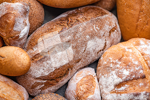 Image of Freshly baked natural bread is on the kitchen table.