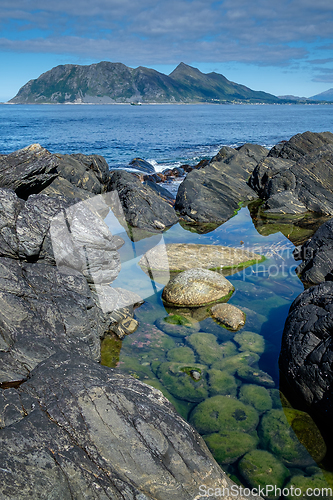 Image of rock formation with a view to Godøya