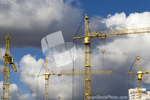 Image of yellow construction cranes