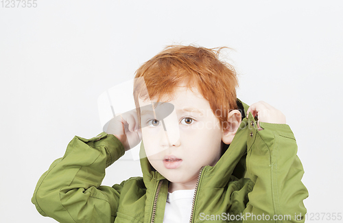 Image of boy in a green jacket