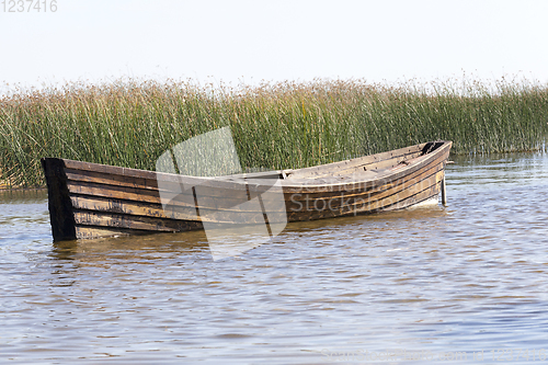 Image of floating wooden boat