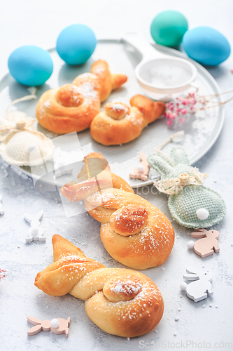 Image of Easter baking - Buns made from yeast dough in a shape of Easter bunny and colored eggs