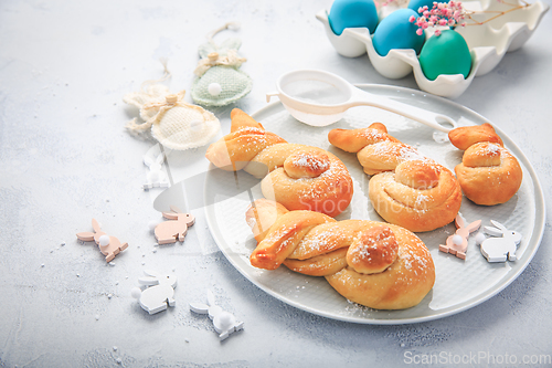 Image of Easter baking - Buns made from yeast dough in a shape of Easter bunny and colored eggs