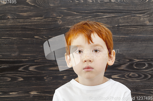 Image of sad red-haired boy