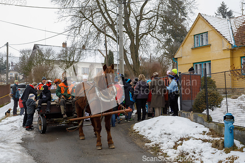 Image of People attend the Masopust Carnival