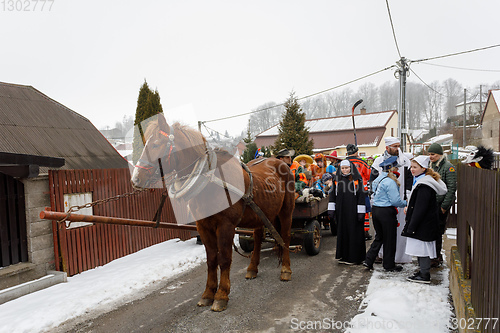 Image of People attend the Masopust Carnival