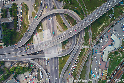 Image of Aerial view of highway and overpass in city.
