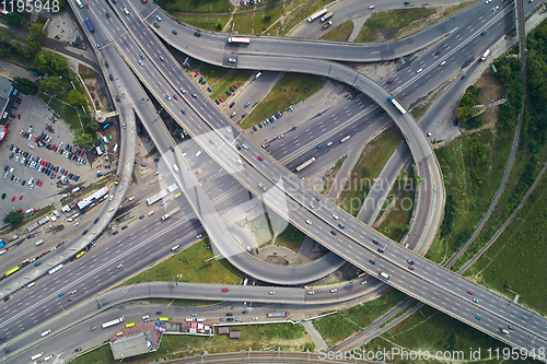 Image of Aerial view of highway and overpass in city.