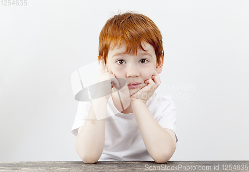 Image of portrait of a boy , tired look