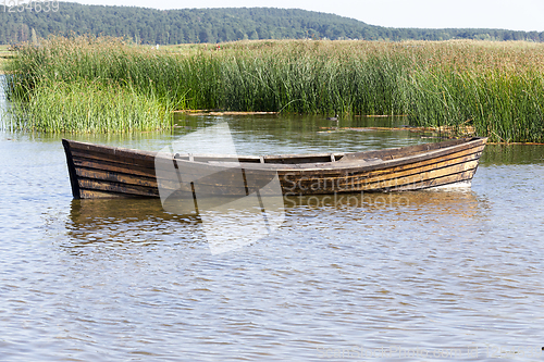 Image of floating wooden boat