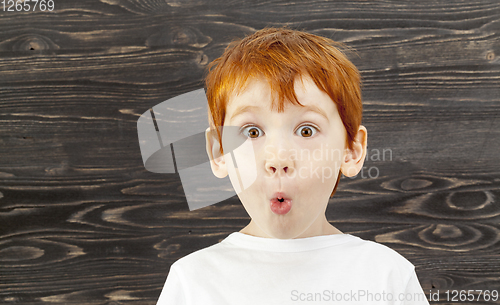 Image of portrait of a surprised child