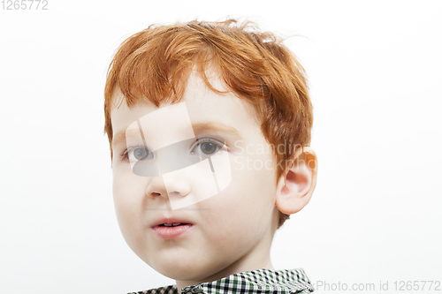 Image of portrait of a child with red hair