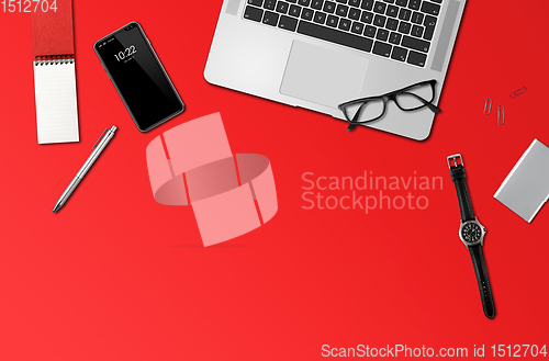 Image of Office desk mockup top view isolated on red