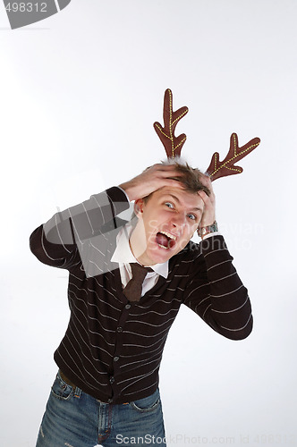 Image of Young man wearing deer horns