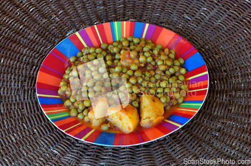 Image of green peas with tomato sauce