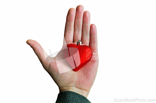 Image of hand holding red heart